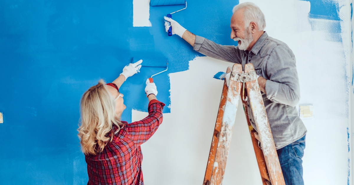 Happy senior couple renovating their home