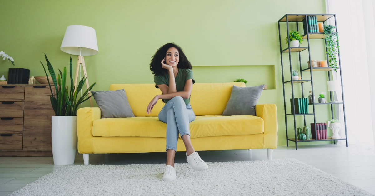 Woman sitting at the couch