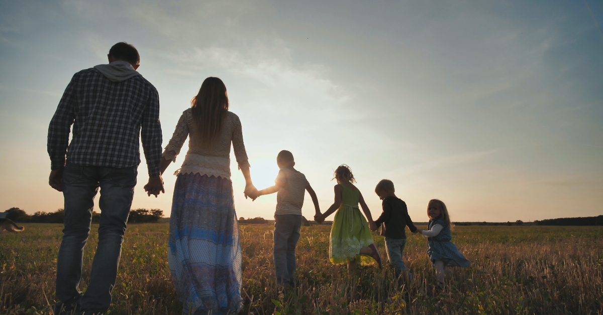 Family walking on the floor at sunset