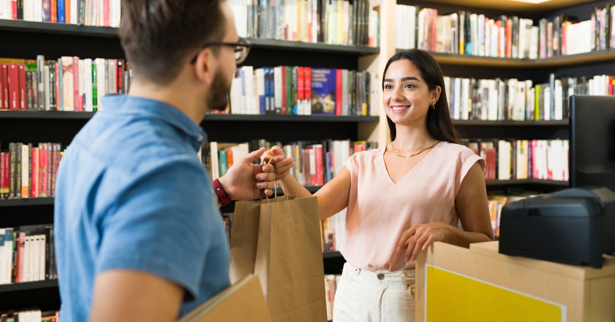 man buying books