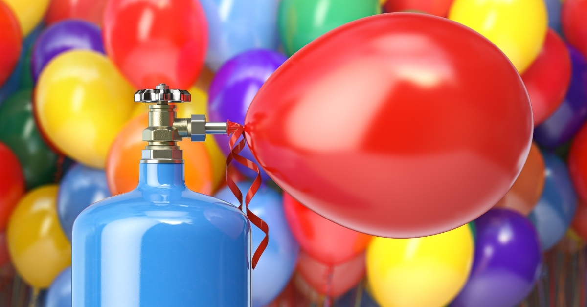 compressed helium inflating colored balloons