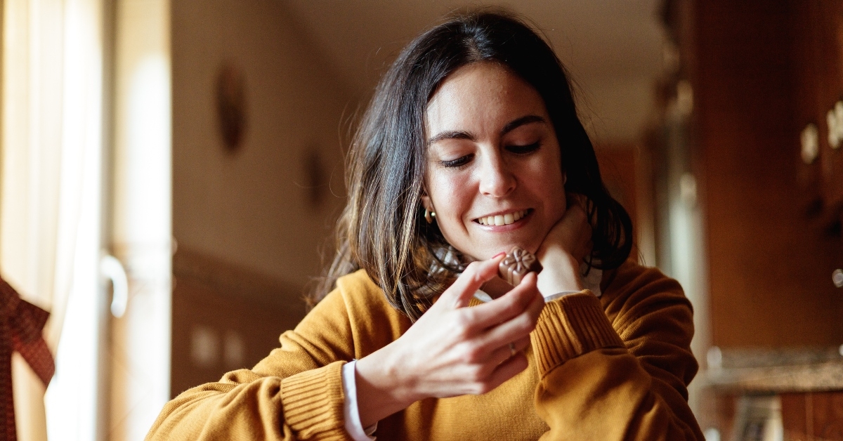 young woman eating chocolate