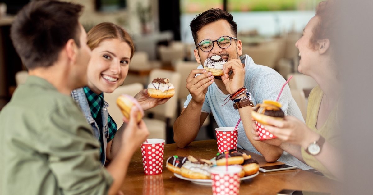 eating donuts and talking in a cafe