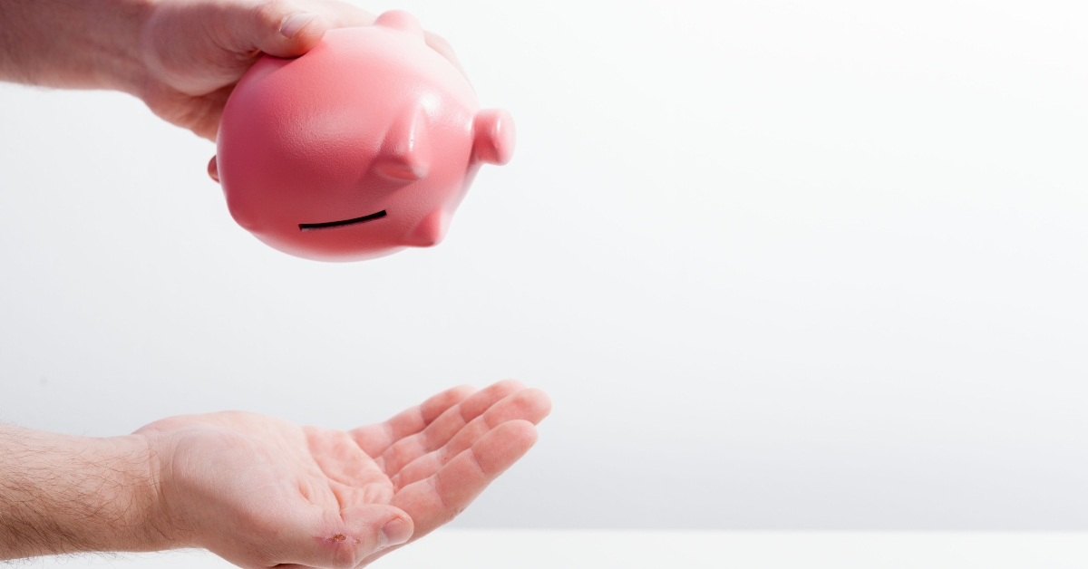 shaking out empty piggy bank