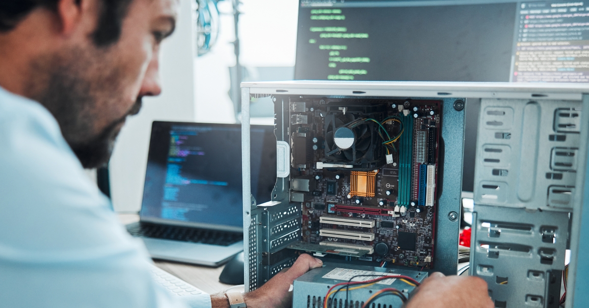 it technician fixing computer