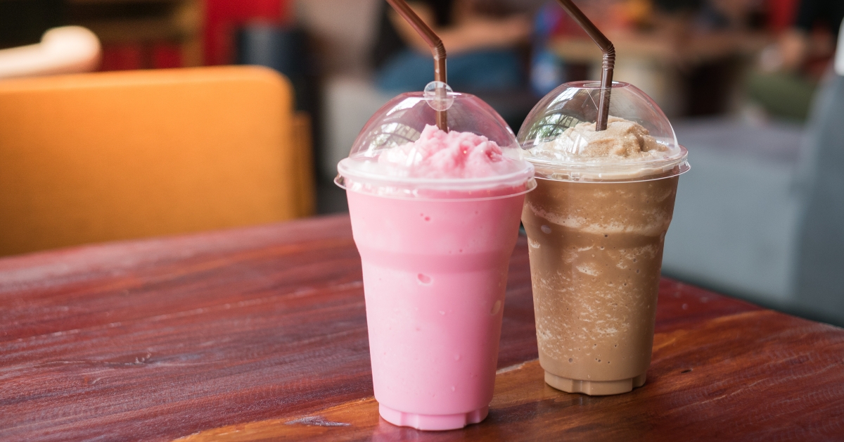 Pink milk and cocoa on table