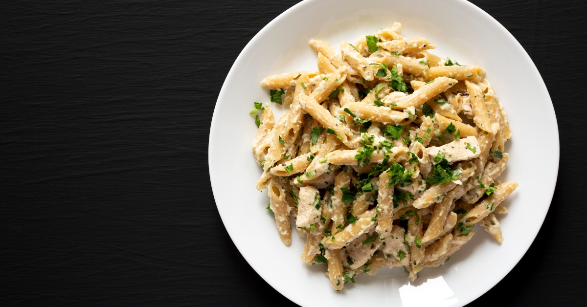 chicken alfredo penne in a plate