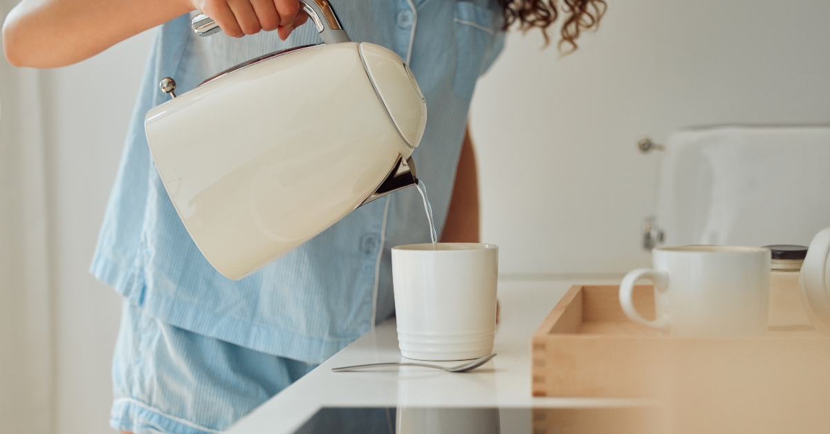 woman pouring a hot water