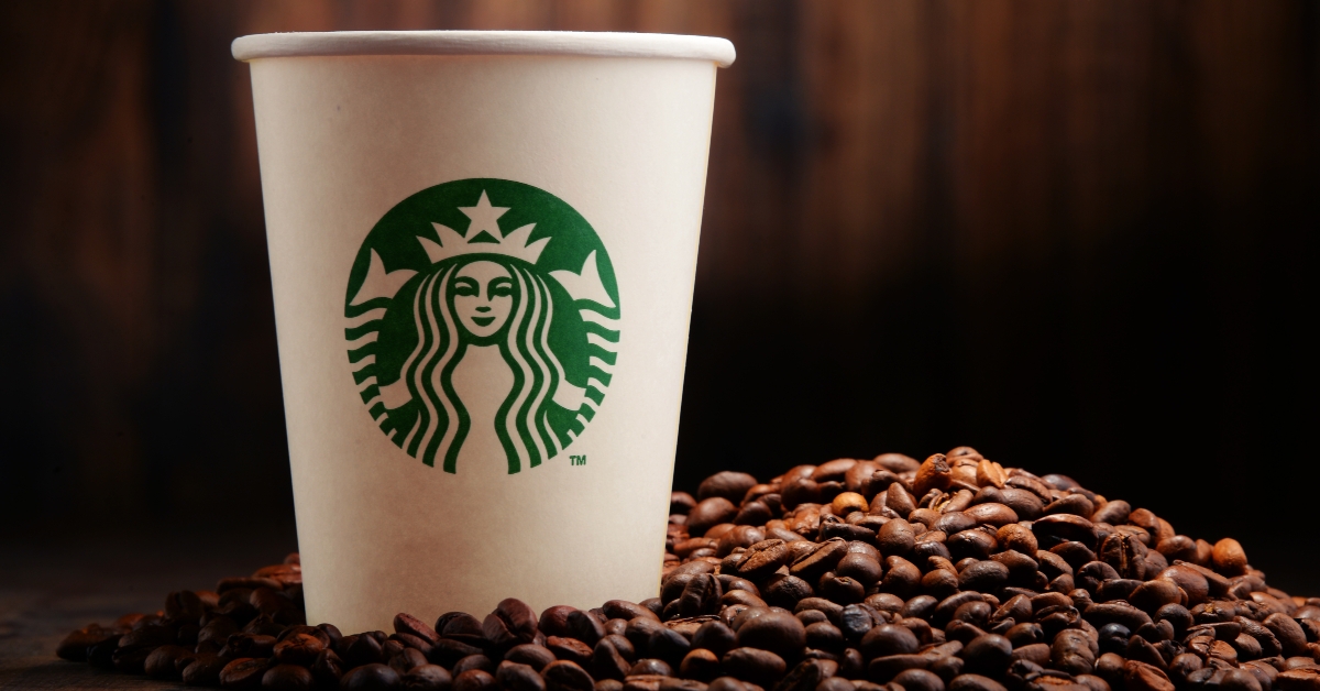 cup of starbucks coffee and beans