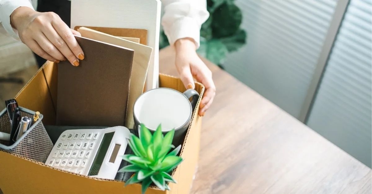 Woman packing up belongings at work