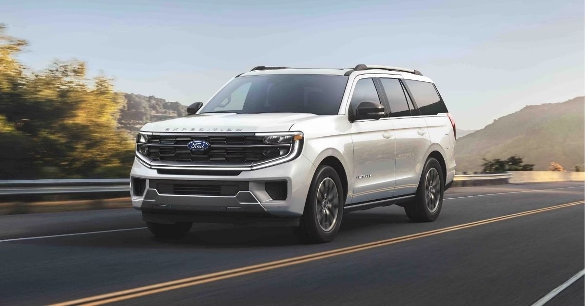 a white ford expedition on the road