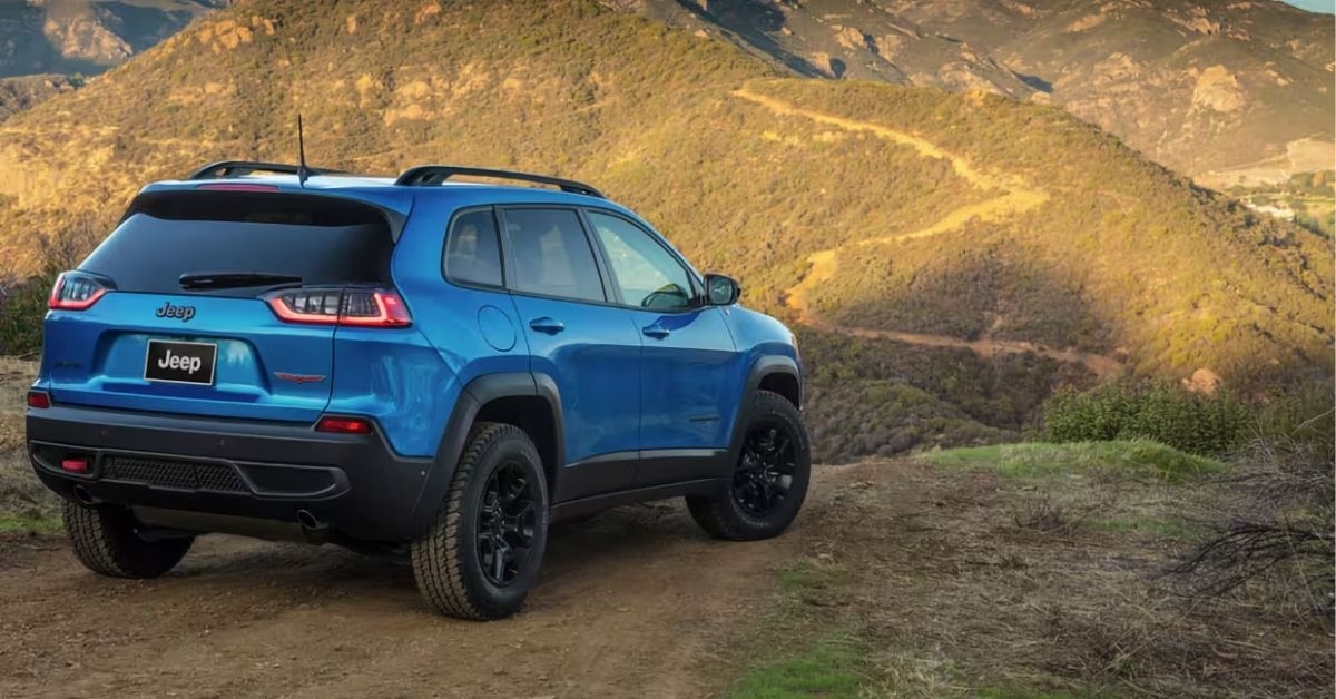 jeep cherokee parking beside a hill