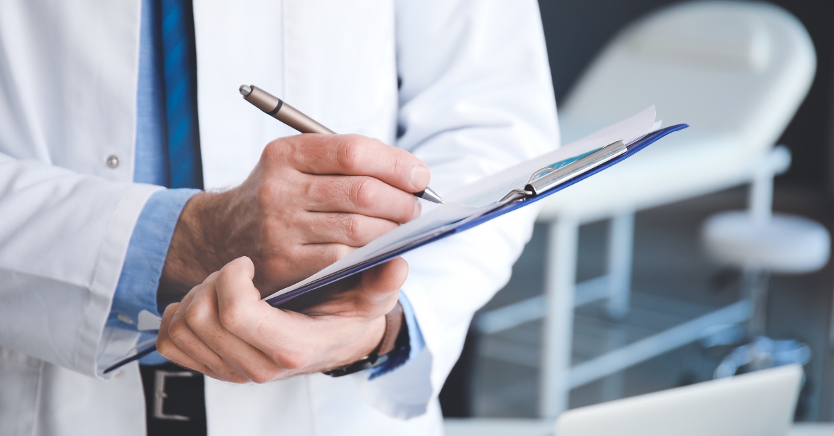 doctor with clipboard in clinic