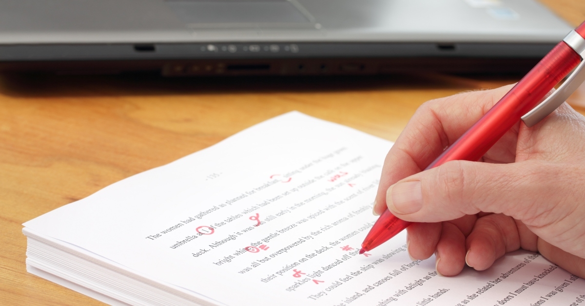 hand with red pen