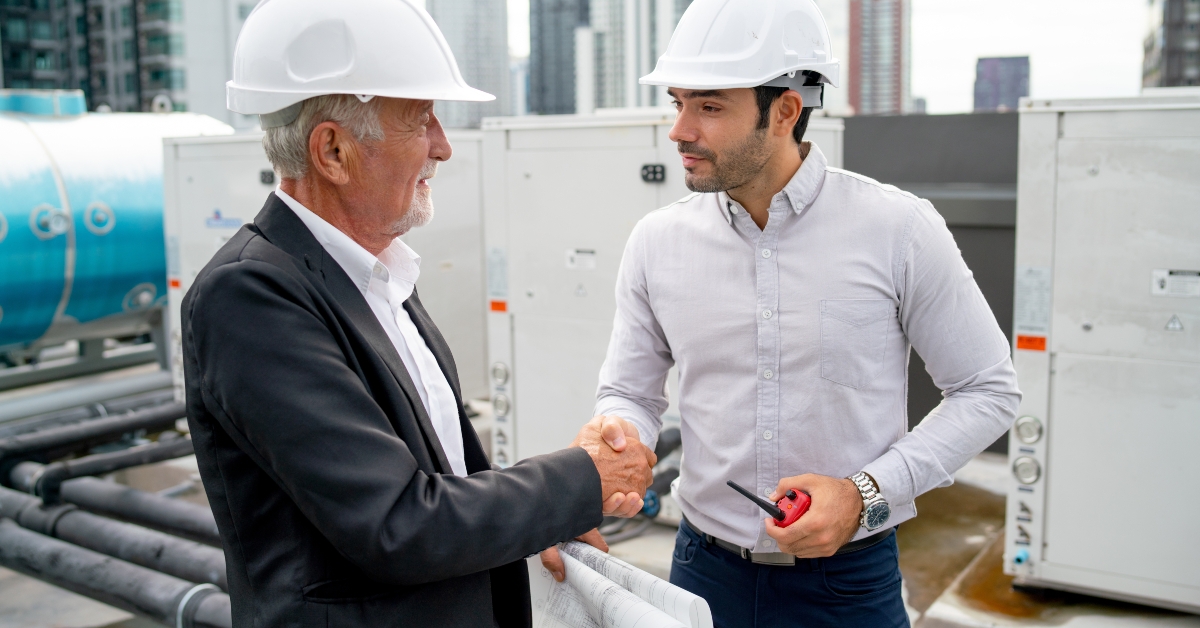 senior engineer man shake hands