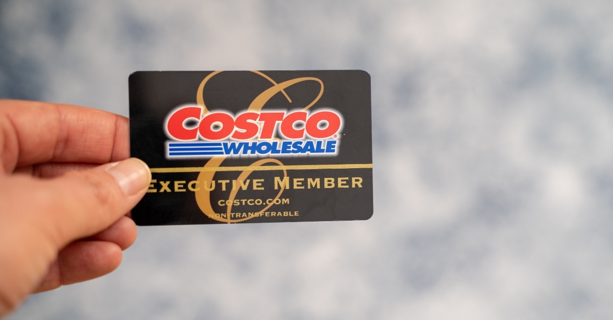 hand holding a costco wholesale executive