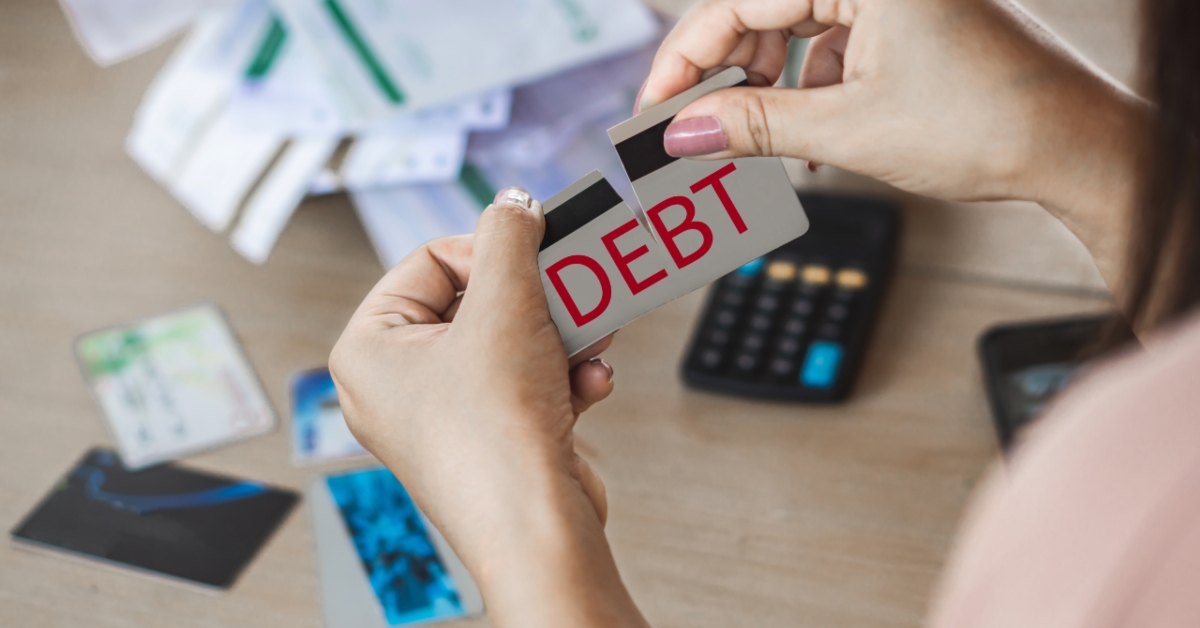 woman holding broken credit card
