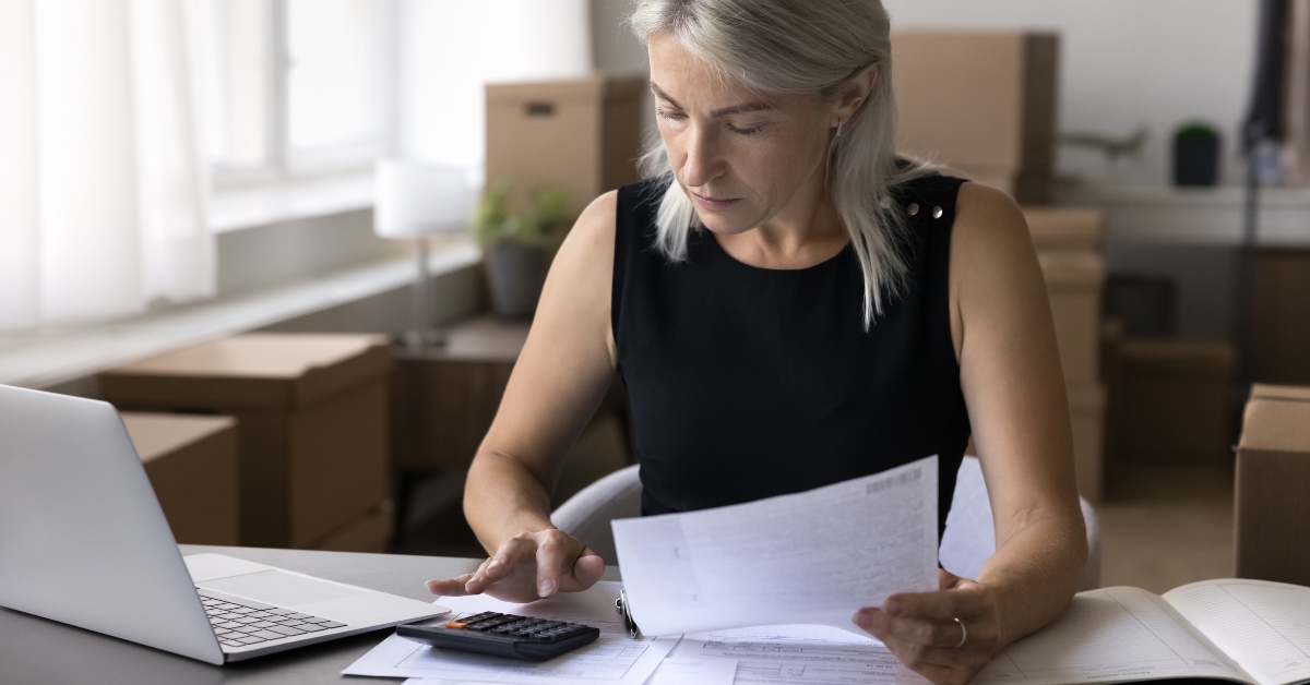 woman sitting doing business papers