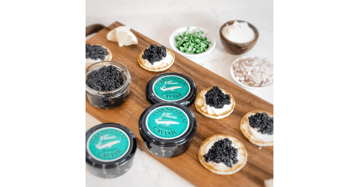 Tsar Nicoulai Caviar jars and servings on a platter