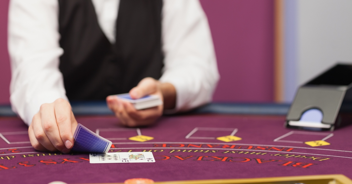 Dealer dealing cards in a casino