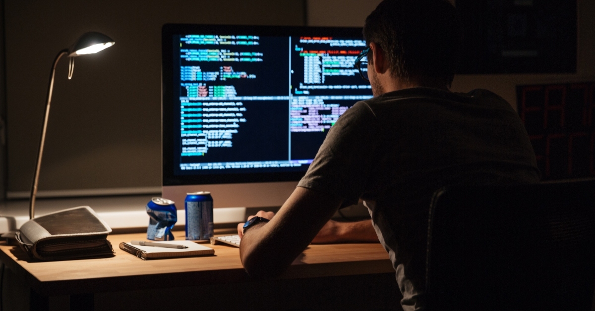 programmer sitting and writing code
