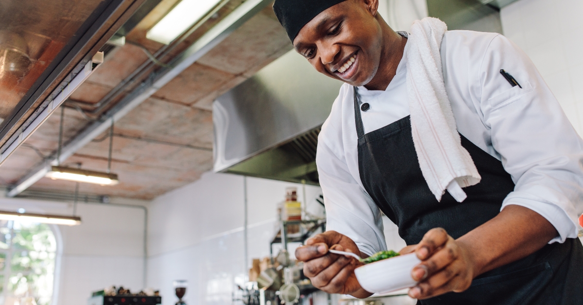 gourmet chef cooking in a commercial kitchen 