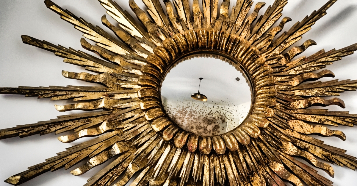 sunburst mirror on white wall