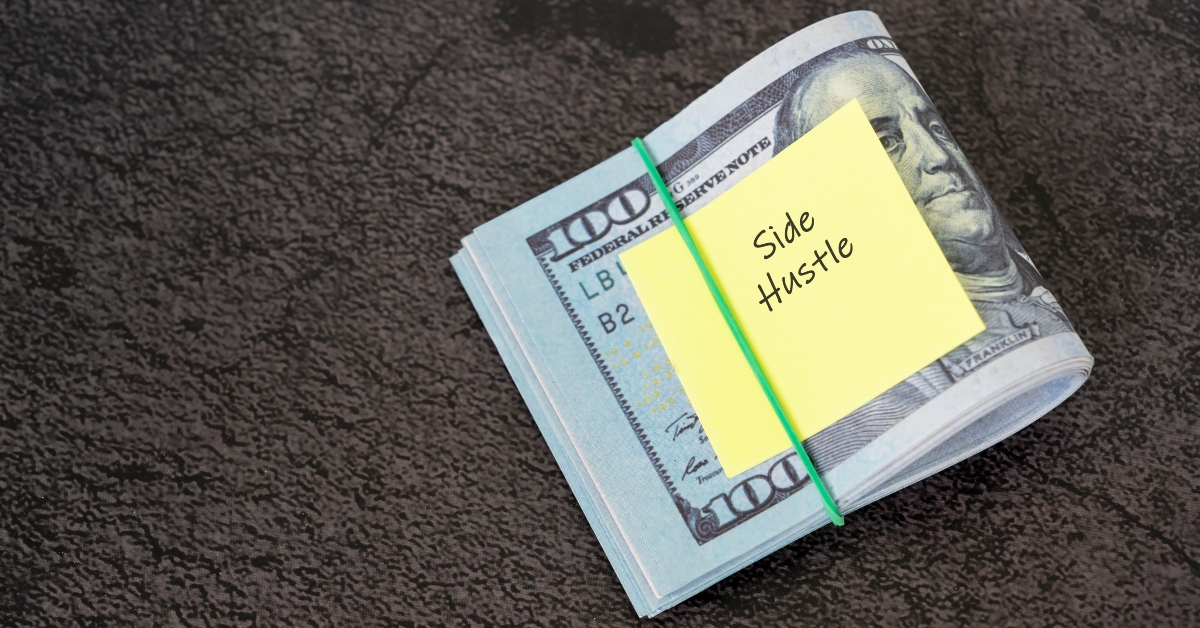 financial bills and adhesive note
