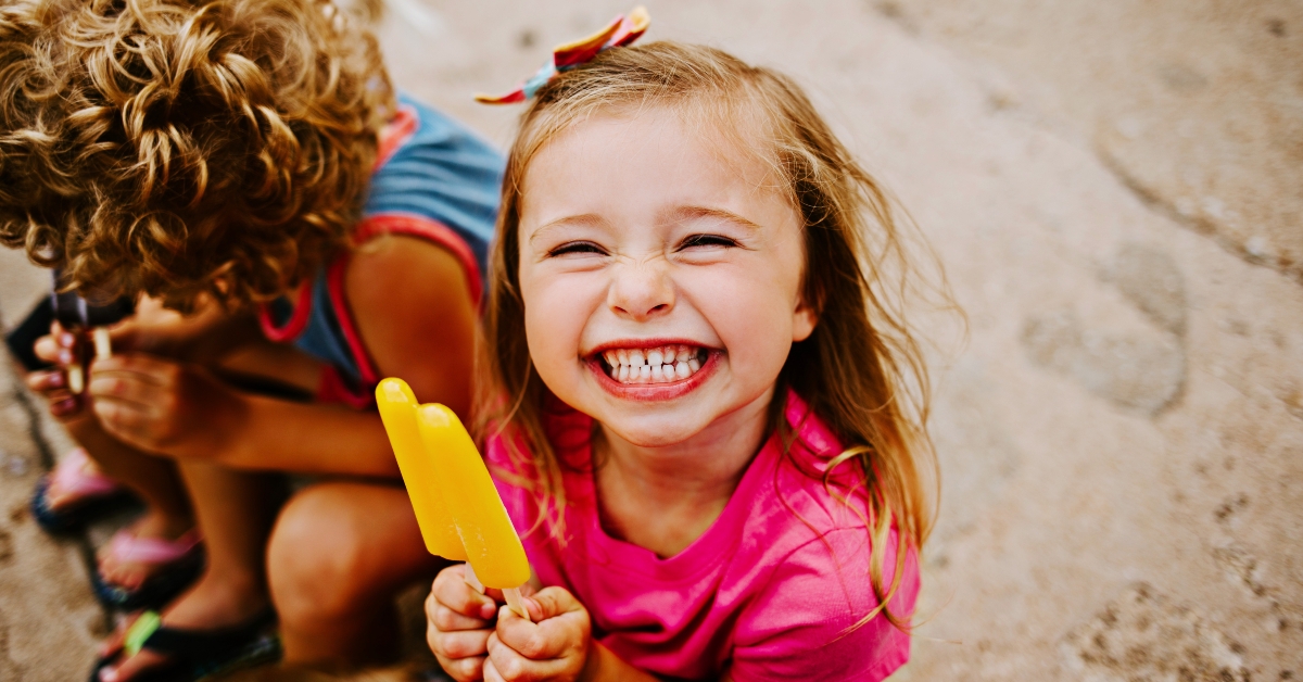 Kids Eating Frozen Colorful Popsicles