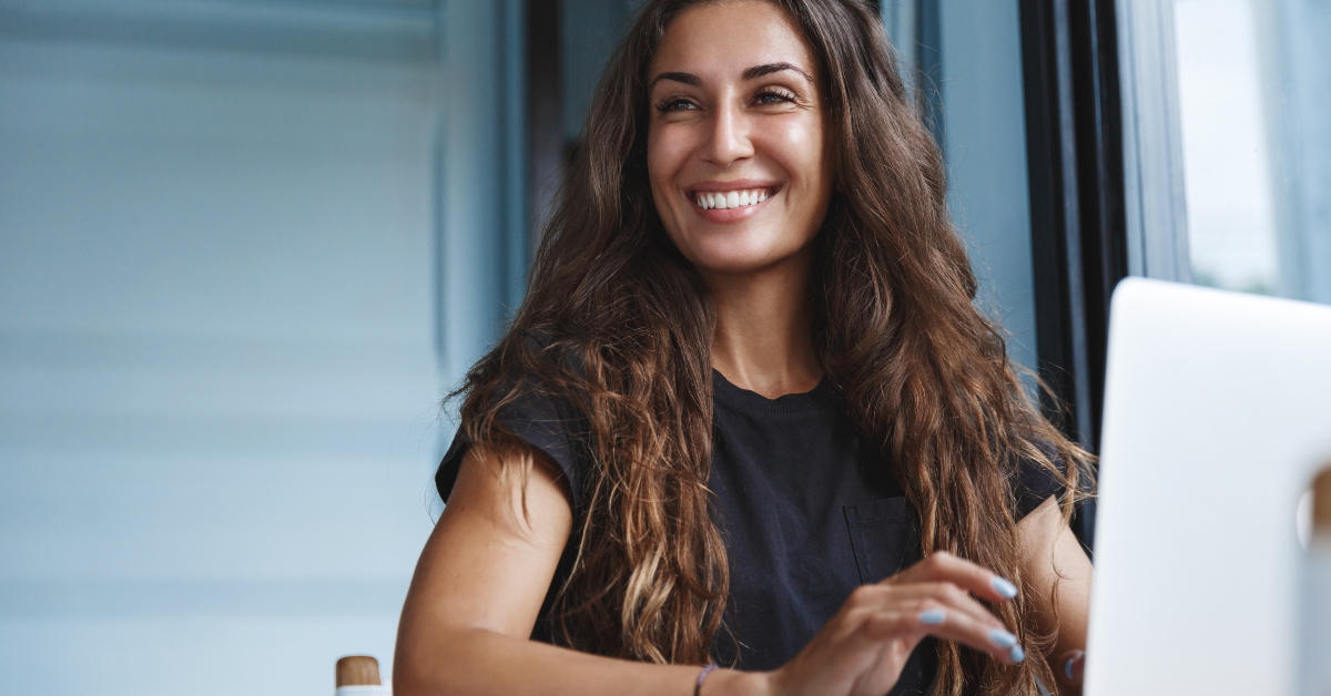 Happy businesswoman looking far