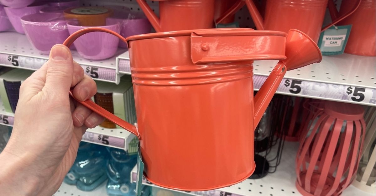 a red watering can