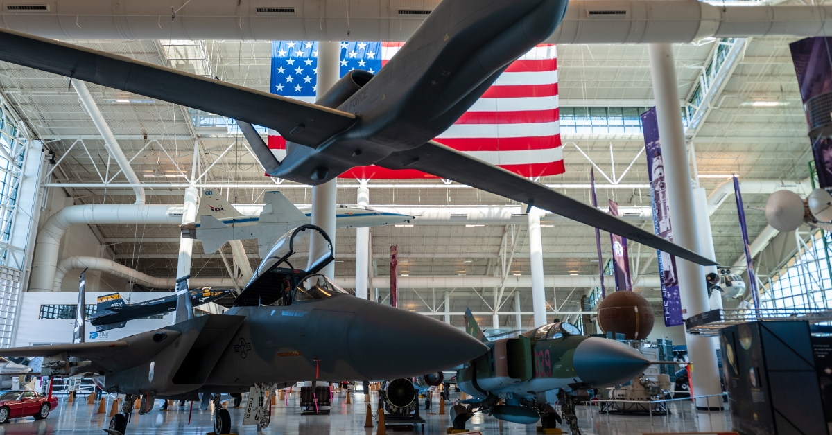 Museum showing a drone and two traditional jet fighters
