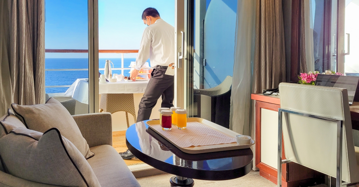 room service waiter rings a full breakfast meal to a cruise ship 
