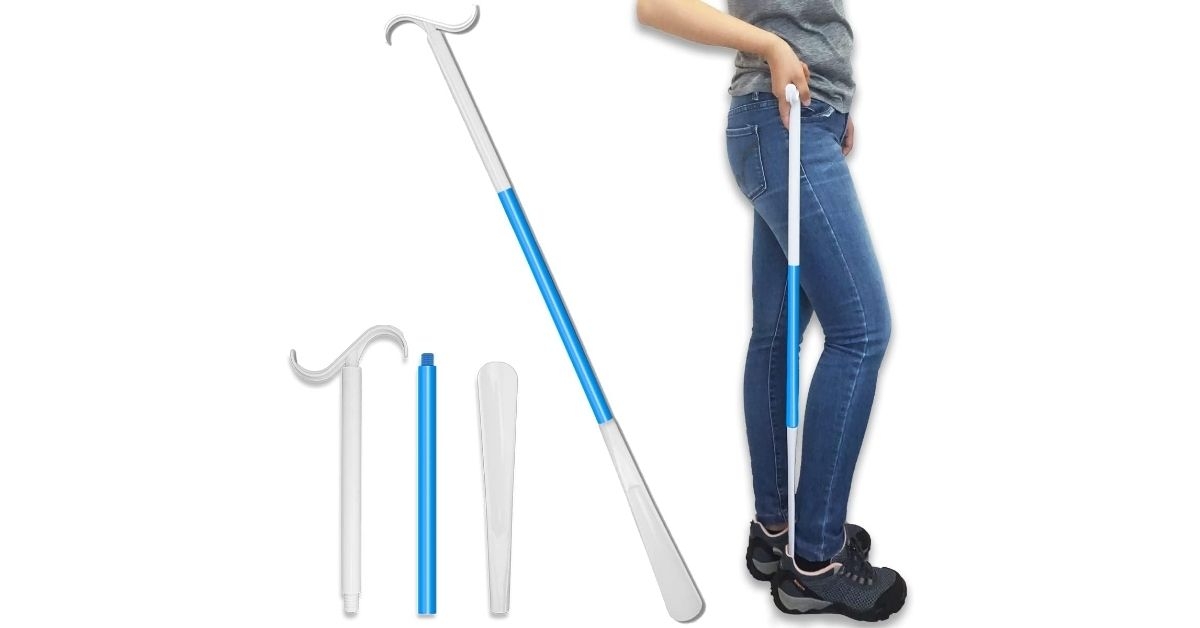 person holding a long handle shoe horn