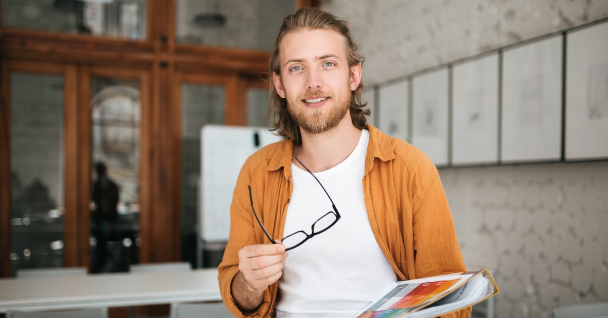 sitting on table in office with glasses