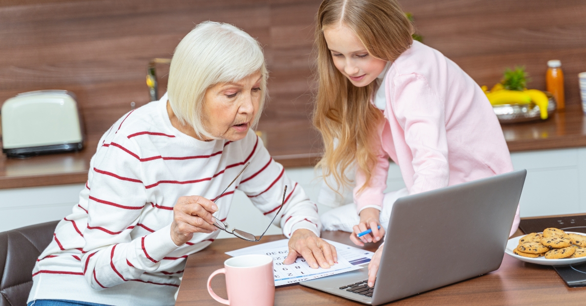 female and her granddaughter looking at the calendar 