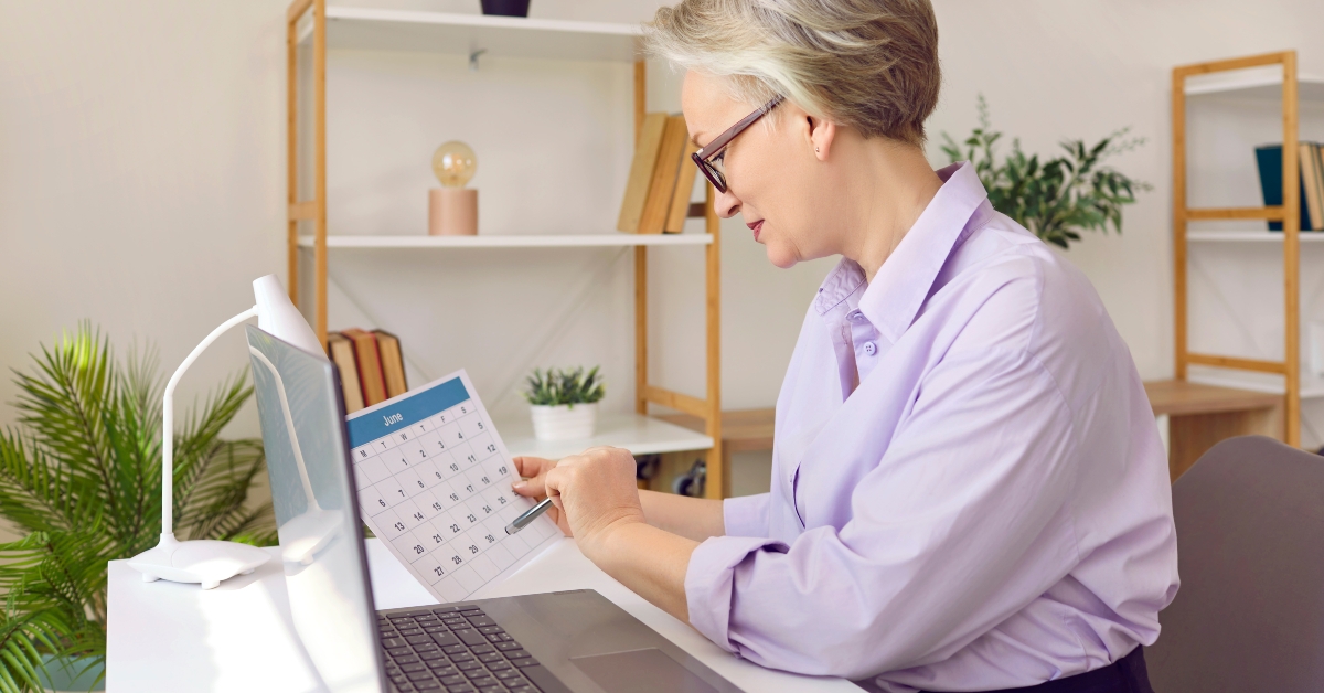 senior business woman checking calendar