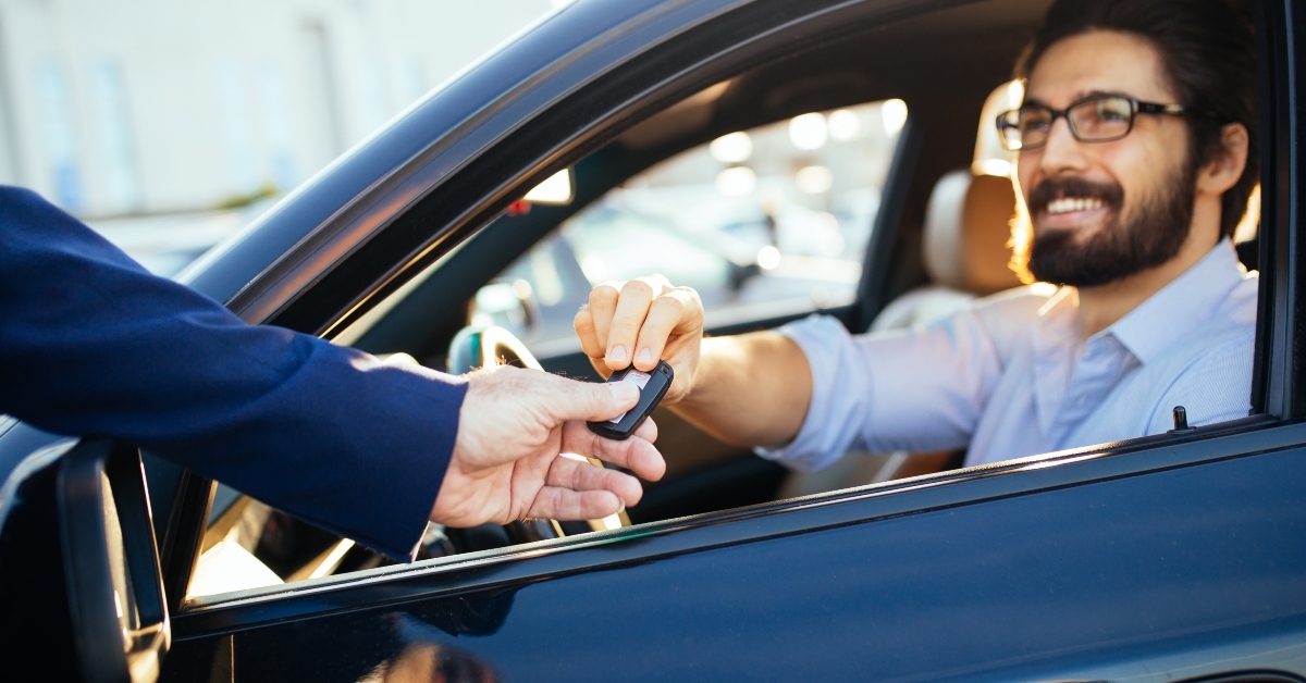 businessman buying used car