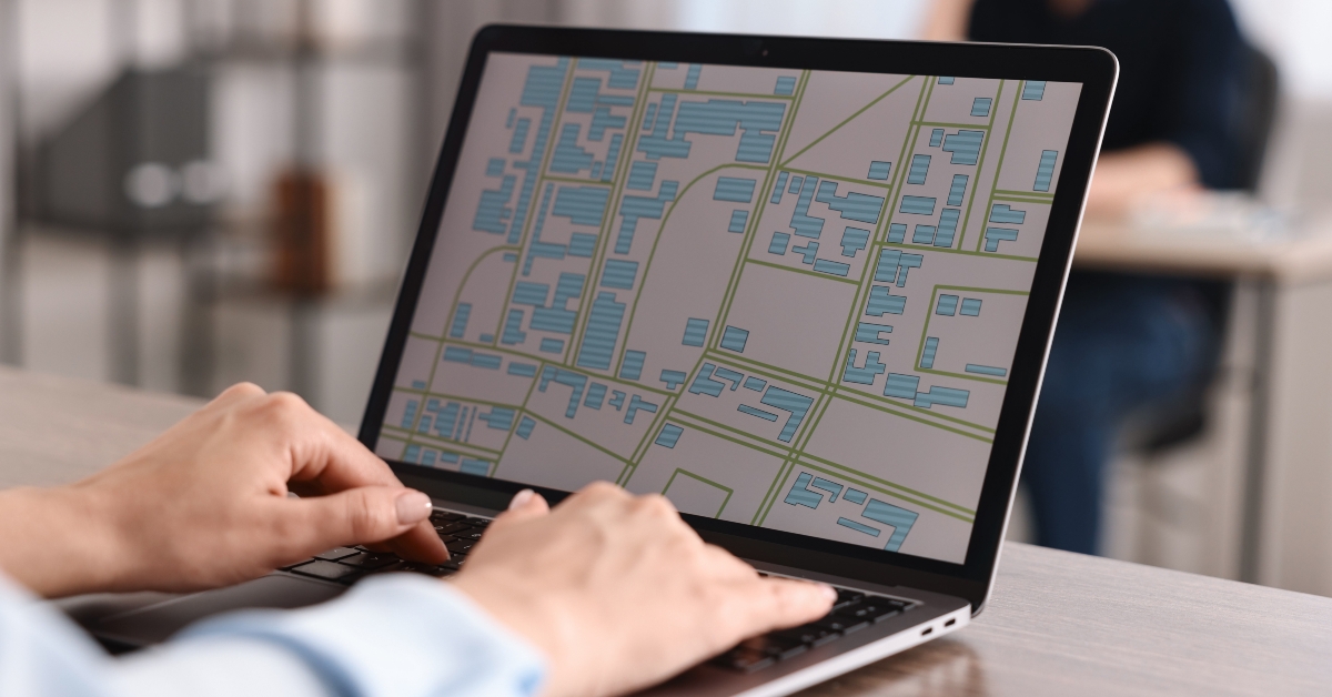 cartographer working with cadastral map