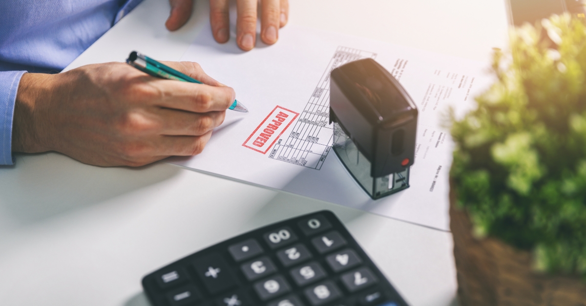 office worker accepting and signing procurement bill