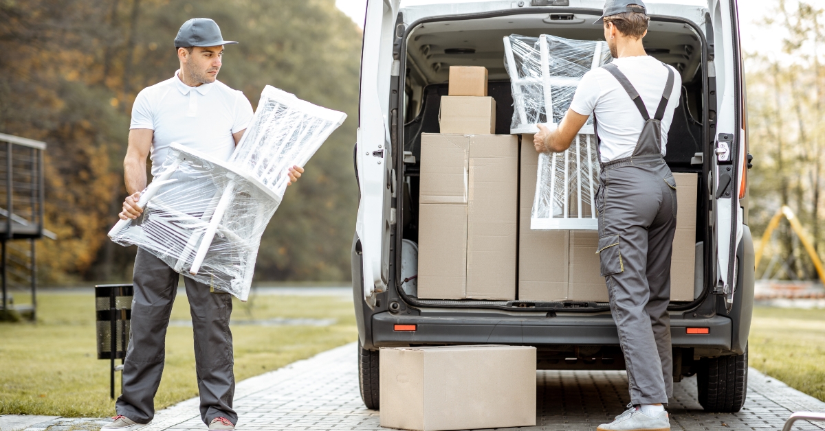employees unloading cargo van vehicle