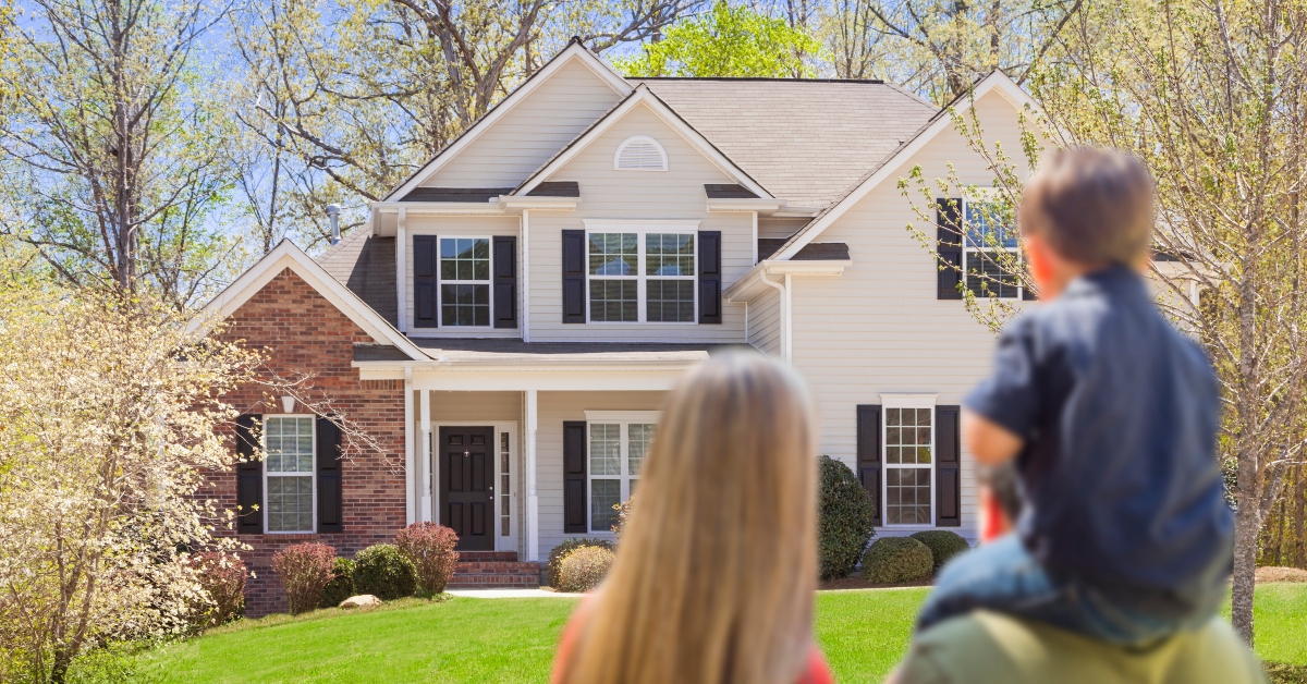 family looking at beautiful home