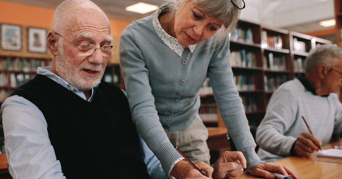 professor teaching an elderly man
