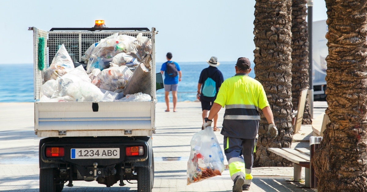 Worker cleaning trash