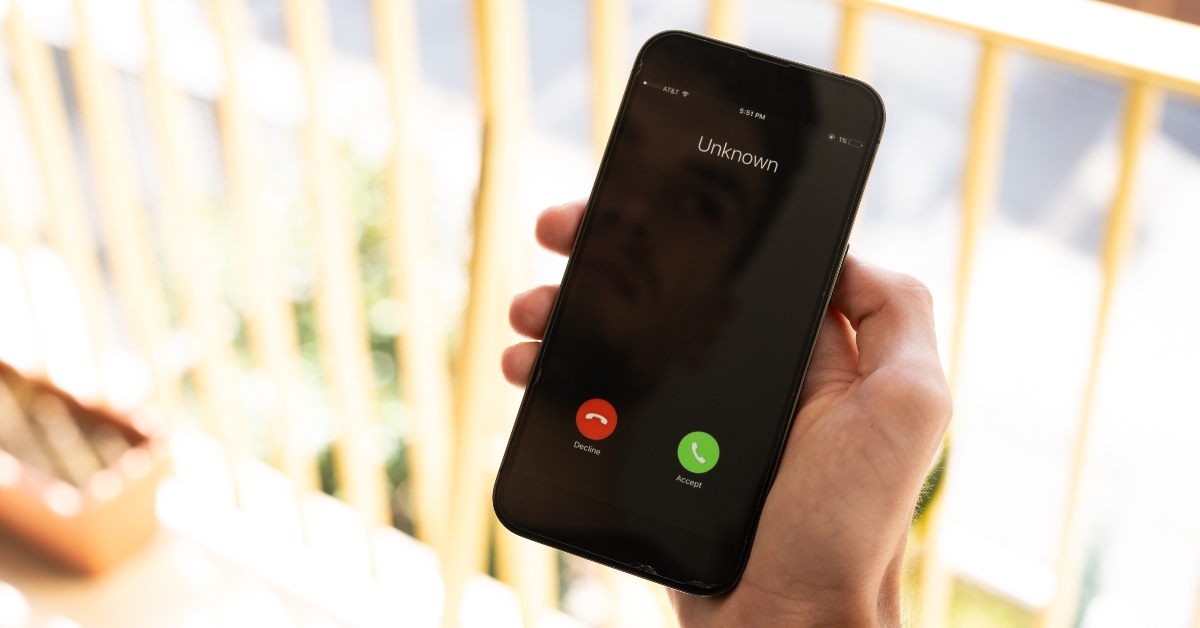 male hand holding a phone