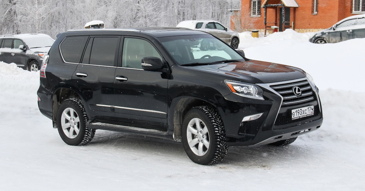 a black lexus on a snowy day