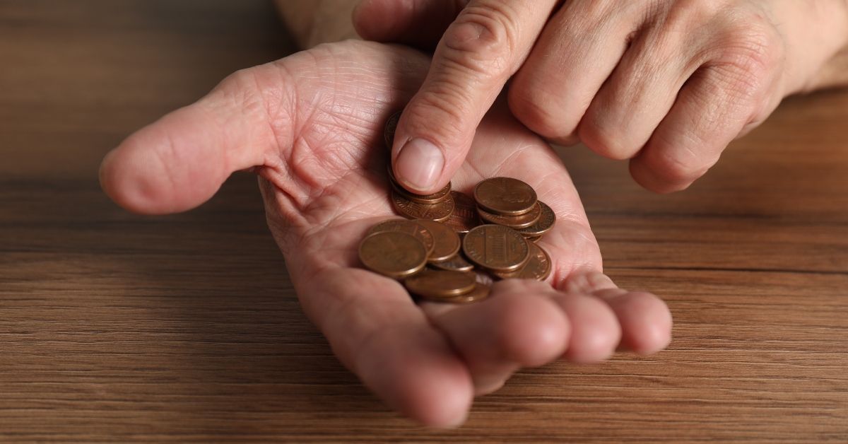 man counting coins 