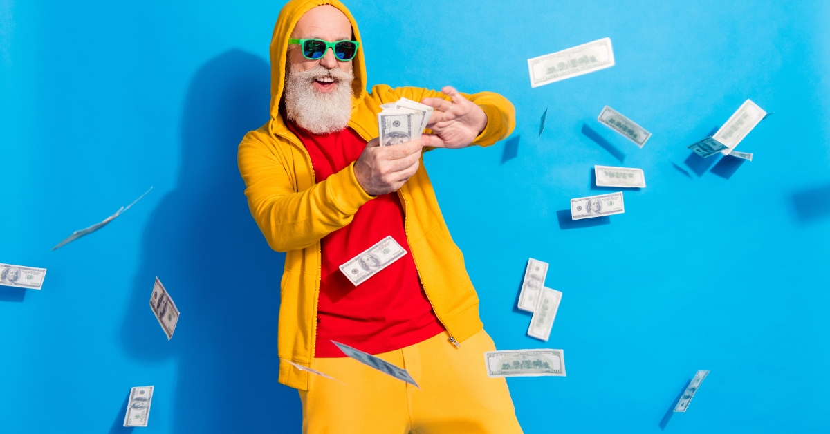 man in sunglass throwing money