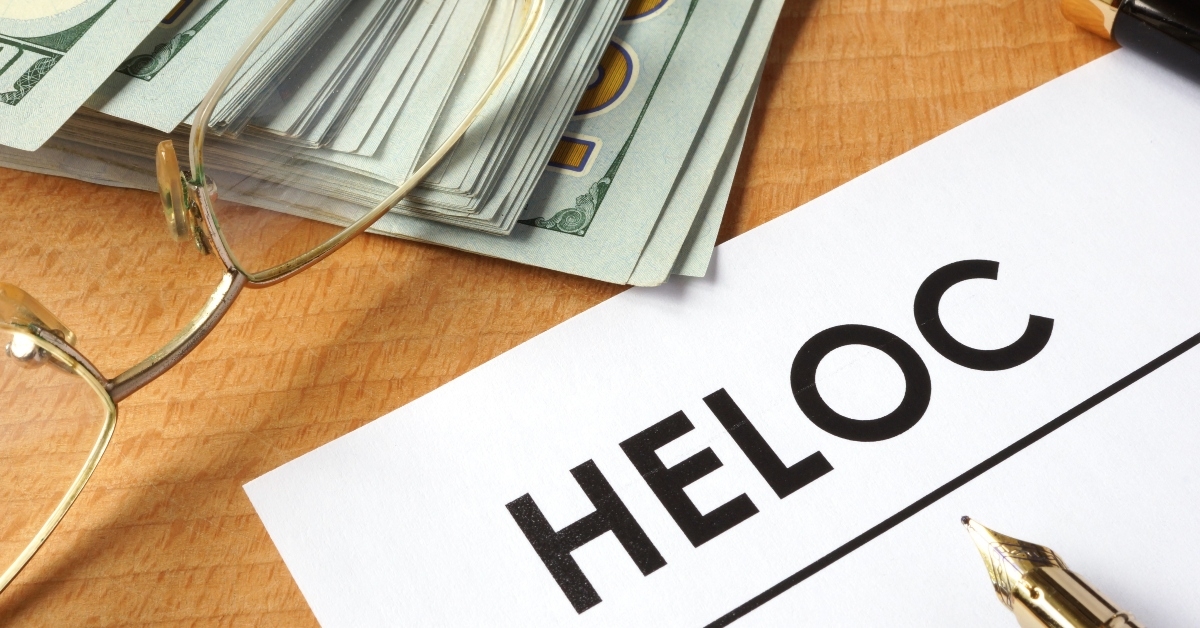 page of paper with heloc and dollars