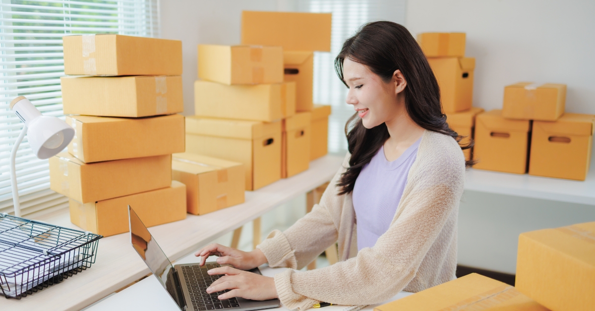 young woman entrepreneur working on laptop